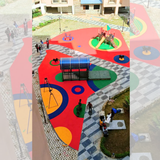 Multicolor red EPDM playground flooring with circular patterns around outdoor play equipment